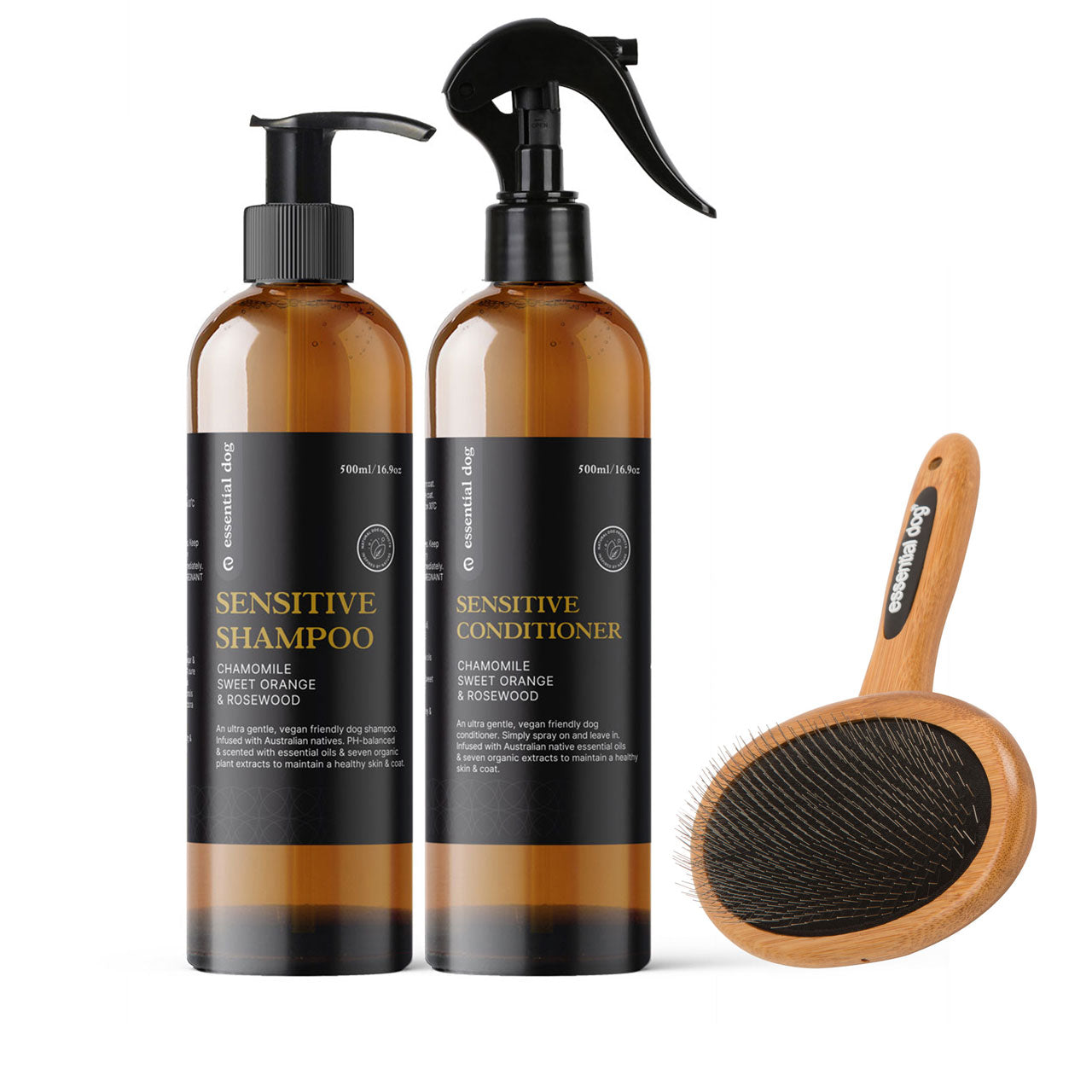 Essential Dog Sensitive shampoo and sensitive conditioner bottles with a natural bamboo slicker brush