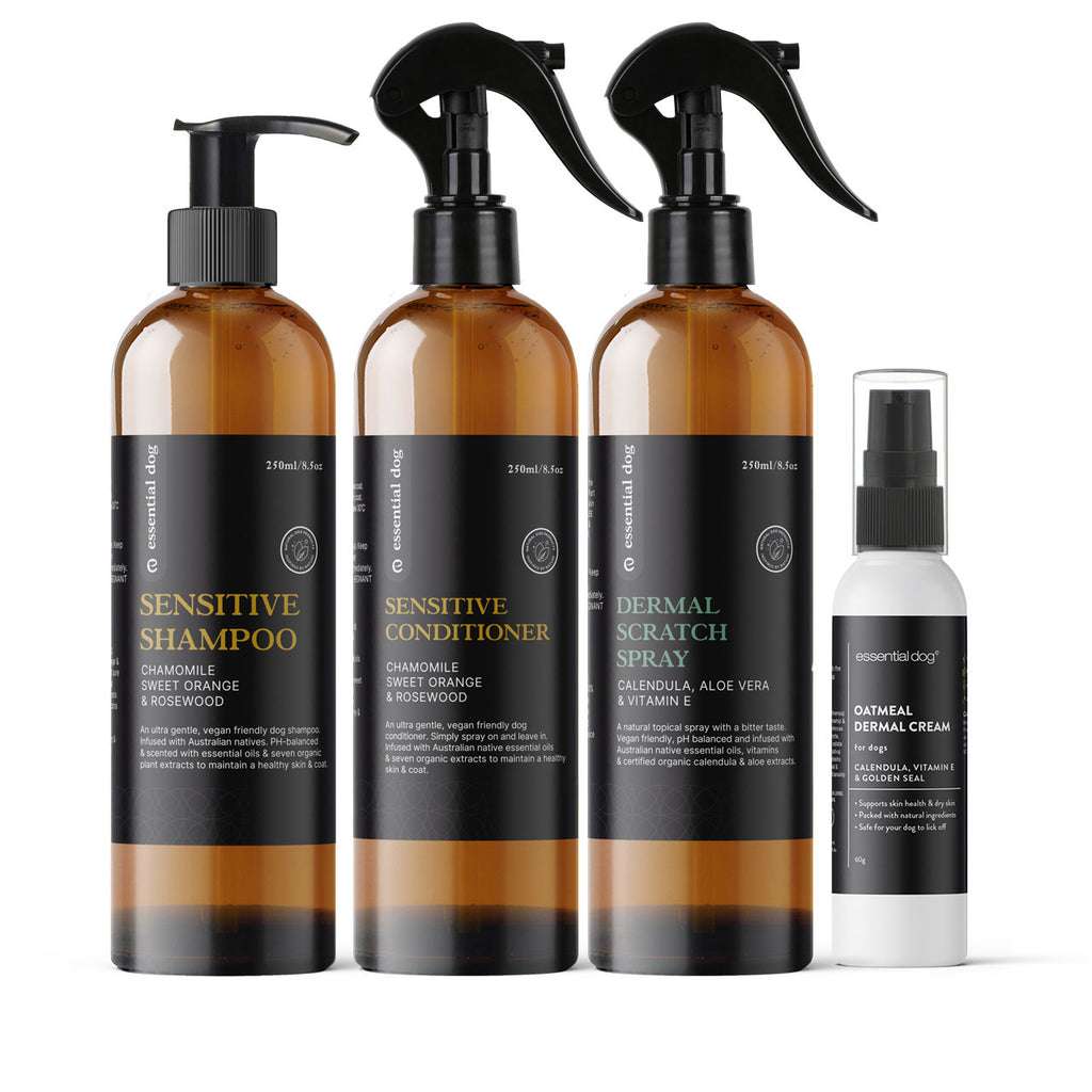 Set of all natural dog skincare products including shampoo, conditioner, and sprays on a white background